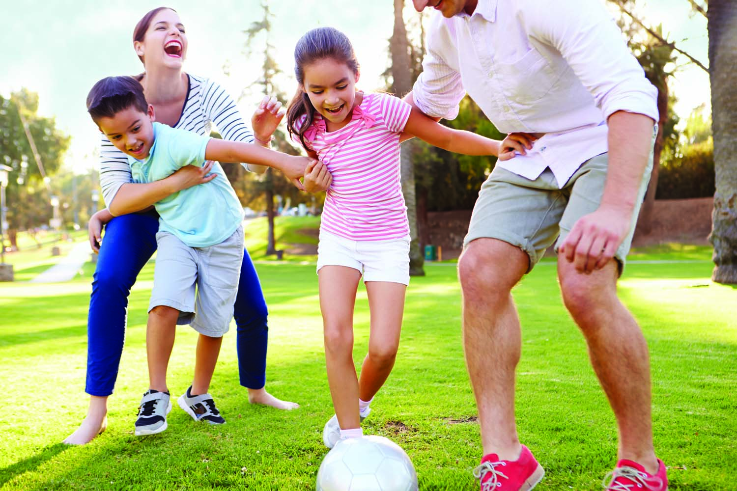 family playing soccer